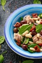 Tuna, white bean salad with olive, red onion, spinach and dried tomato. Healthy food. Royalty Free Stock Photo