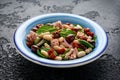 Tuna, white bean salad with olive, red onion, spinach and dried tomato. Healthy food. Royalty Free Stock Photo