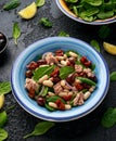 Tuna, white bean salad with olive, red onion, spinach and dried tomato. Healthy food. Royalty Free Stock Photo
