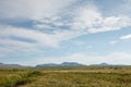 The tundra leads to the mountains. Plenty. Clear summer day. Wildlife travel concept