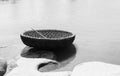 Tungabhadra River at Hampi. In the foreground is a round boat in monochrome. Royalty Free Stock Photo