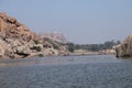 Tungabhadra river in Hampi, Karnataka - tourists enjoying coracle ride in deep river - India tourism Royalty Free Stock Photo