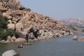 Tungabhadra river in Hampi, Karnataka - tourists enjoying coracle ride in deep river - India tourism Royalty Free Stock Photo