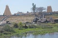 Tungabhadra river in the village of Hampi. Big stone. Tropical exotic landscape. Beautiful green valley. View from above