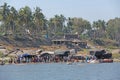 Tungabhadra river in the village of Hampi and the transfer of local residents and tourists to the other shore. Big stone. Tropical