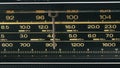 Tuning analog radio dial frequency on scale of the vintage receiver