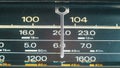 Tuning analog radio dial frequency on scale of the vintage receiver