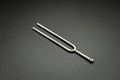 A tuning fork 440 Hz on a black background Royalty Free Stock Photo