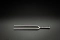 A tuning fork 440 Hz on a black background Royalty Free Stock Photo
