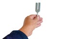Tuning fork in sound therapy or tunning musical instruments Royalty Free Stock Photo