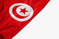 Tunisia flag of fabric with copyspace for your text on white background