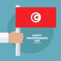 Tunisia Independence Day, 20 march greeting card with hand holding tunisian flag. Royalty Free Stock Photo