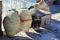 Tunisian amphoras on the floor decorated with ceramic tiles and blue railing in Tunisia Royalty Free Stock Photo