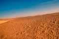 Tunisian desert landscape with blue sky. Dunes background Royalty Free Stock Photo