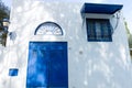 Tunisian eastern courtyard houses with white walls and blue windows doors Royalty Free Stock Photo