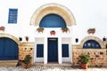 Tunisian eastern courtyard houses with white walls and blue windows doors Royalty Free Stock Photo