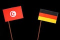 Tunisian flag with German flag on black Royalty Free Stock Photo