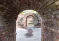 Tunnel arch building ruins brick building with cement floor, fragment of catacombs