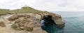 Tunnel Beach Sandstone cliffs at the beach near Dunedin, New Zealand.