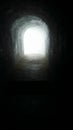Tunnel darkness light path entrance exit Royalty Free Stock Photo