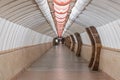 Tunnel of empty heptagonal long futuristic underpass, lined with ceramic tiles