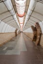 Tunnel of empty heptagonal long futuristic underpass, lined with ceramic tiles