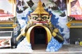 Tunnel gate of rahu titan demon lunar eclipse statue go to under ordination hall or ubosot for thai people travel visit respect