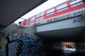 Tunnel with graffiti walls under a fast-moving train at Diebsteich station in Hamburg, Germany Royalty Free Stock Photo