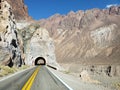 Tunnel mountain road route asphalt straight desert Royalty Free Stock Photo