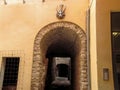 Tunnel with the sign of the devil on the wall on Witches Street in Cervera province Lleida, Catalonia in Spain. Old street with