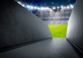 Tunnel in stadium with green soccer field