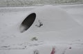 Tunnel on a stainless steel playground. igloo hill covered with snow. modern stainless steel polar bear for a polar bear in a zoo Royalty Free Stock Photo