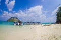 TUP, THAILAND - FEBRUARY 09, 2018: Amazing view of unidentified people in the beach close to a long tail boats in a row Royalty Free Stock Photo