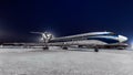 Tupolev Tu-154m Alrolsa Airlines parked at the airport at night