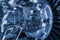 Turbine Engine. Aviation Technologies. Aircraft jet engine detail during maintenance. Blue toned. Royalty Free Stock Photo