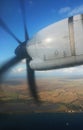 Turbo Prop Engine in Flight over Ocean and Island Coastline