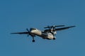 Turbo prop WestJet plane with deployed nose gear near Pearson International Airport, Toronto Royalty Free Stock Photo