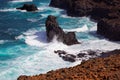 Turbulent ocean waves crashing into rocky shoreline of Sao Nicolau island, Cape Verde Royalty Free Stock Photo
