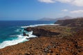 Turbulent ocean waves crashing into rocky shoreline of Sao Nicolau island, Cape Verde Royalty Free Stock Photo