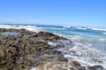 Turbulent ocean waves with white foam beat coastal stones, Fuerteventura, Canary Islands at La Pared