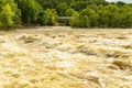 A Turbulent River with Whitecaps and Whirlpools after Spring Rain.