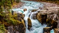 The turbulent turquoise water of the Sunwapta River as it tumbles down Sunwapta Falls in Jasper National Park Royalty Free Stock Photo