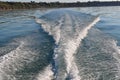 Turbulent water behind a speeding boat