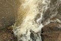 Turbulent water discharge over stone surface interface Royalty Free Stock Photo