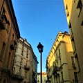 Turin city, street lamp, flying birds and sky Royalty Free Stock Photo