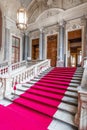 Turin, Italy - Circa January 2022: red carpet in Royal Palace - luxury elegant marble stairway