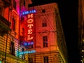 Hotel and Ristorante Neon signboard in an Italian street at night. Turin, Italy