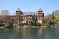 Valentino castle red bricks facade and Po river, sunlight in Piedmont, Turin, Italy