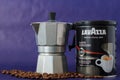 TURIN, ITALY - 2 May 2019: Lavazza Coffee Jar on the Violet Background. Moka Pot and Lavazza Coffee Package, TURIN, ITALY. An