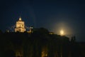 Turin, Italy. Night view of the Church of Santa Maria al Monte dei Cappuccini with the rising full moon on the right. July 13, Royalty Free Stock Photo